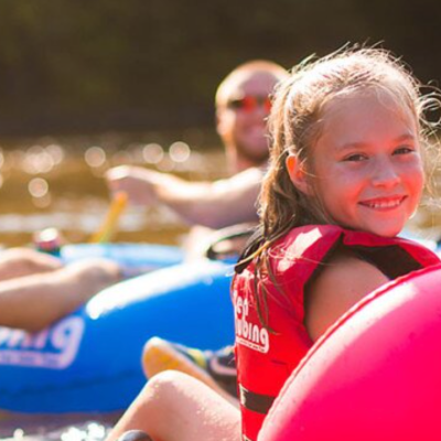 a little girl playing with a frisbee
