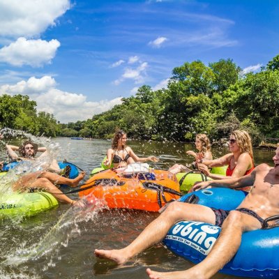 a group of people on a raft in the water