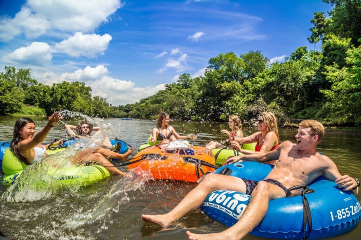 a group of people on a raft in the water