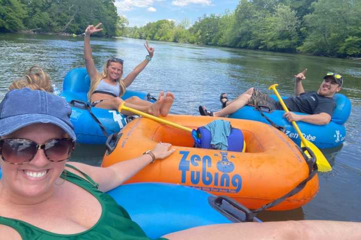 a group of people on a raft in a body of water