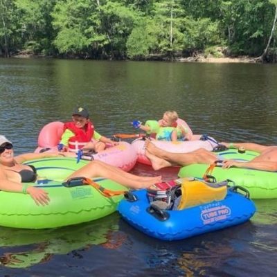 a group of people on a raft in a body of water