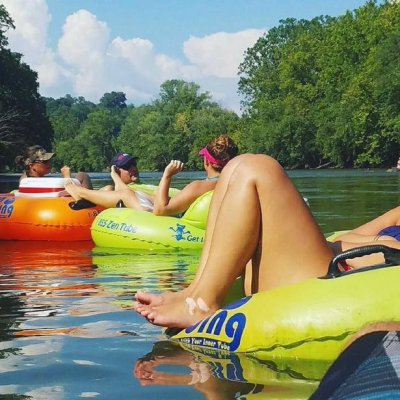 a woman sitting on a boat in the water