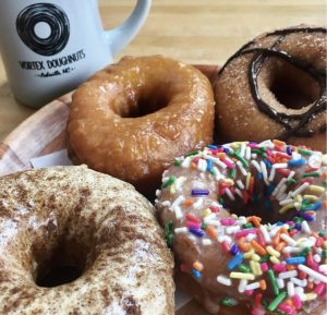 a box filled with different kinds of donuts