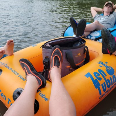 a woman sitting on a boat in the water