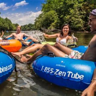 a group of people riding on the back of a boat