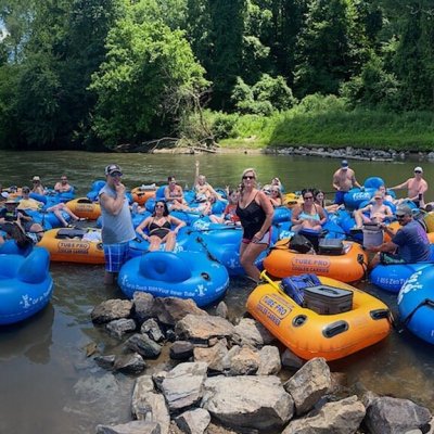 a group of people on a raft in the water