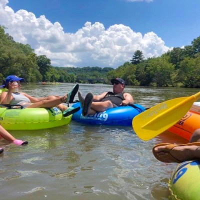a group of people on a raft in the water