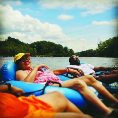 a group of people sitting at a beach