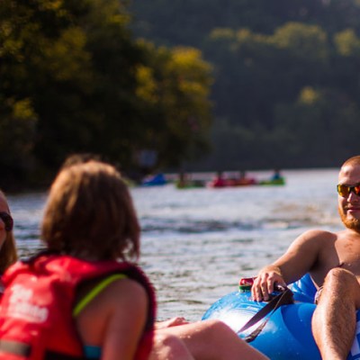a person riding on the back of a boat