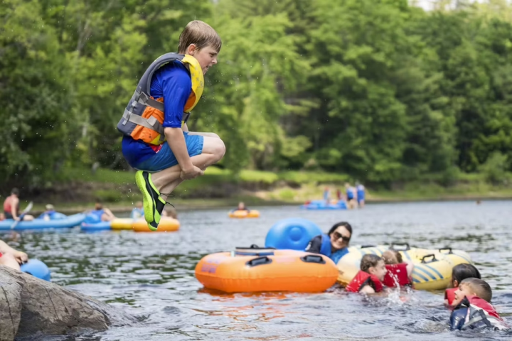 a group of people playing frisbee in the water