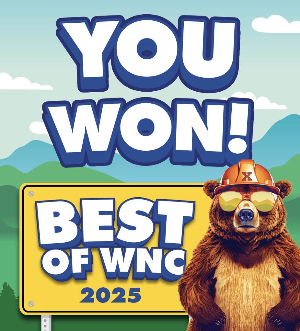 Cartoon bear in hard hat and sunglasses next to 'YOU WON! BEST OF WNC 2025' sign.